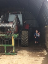 C and George the pig visiting a tractor