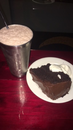 My 11:30 pm diner of a milkshake and cake after flying. It was vegan cake so I can pretend it's healthy